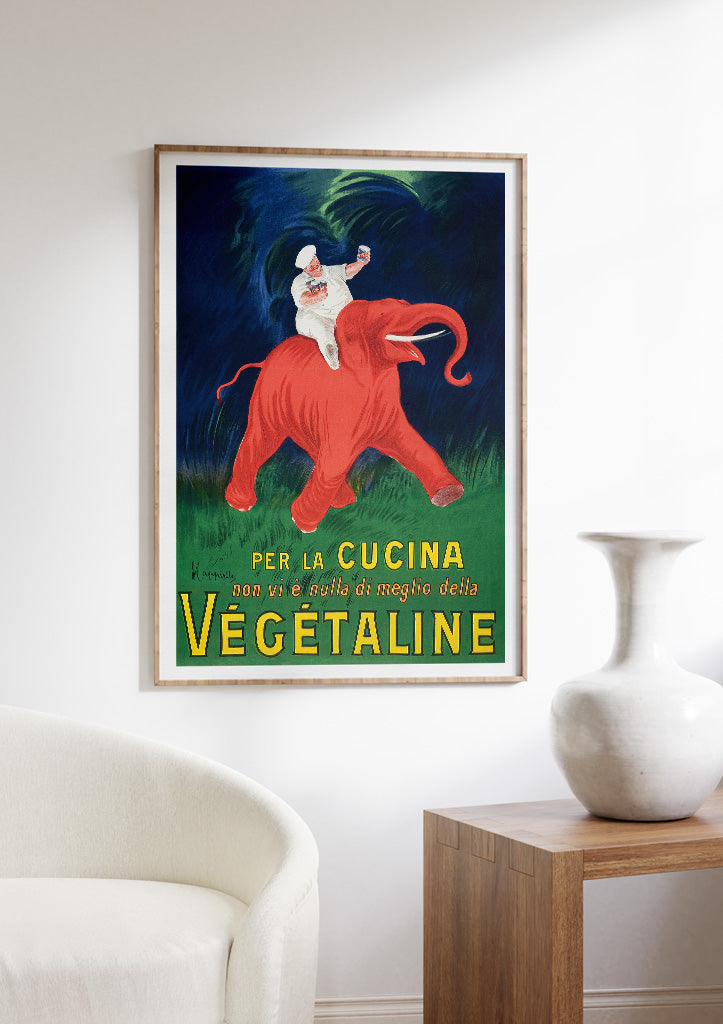 Retro style poster from Leonetto Cappiello featuring an iconic illustration of a chef on a red elephant.